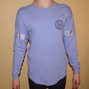 Pink, light purple, long sleeved tee shirt.